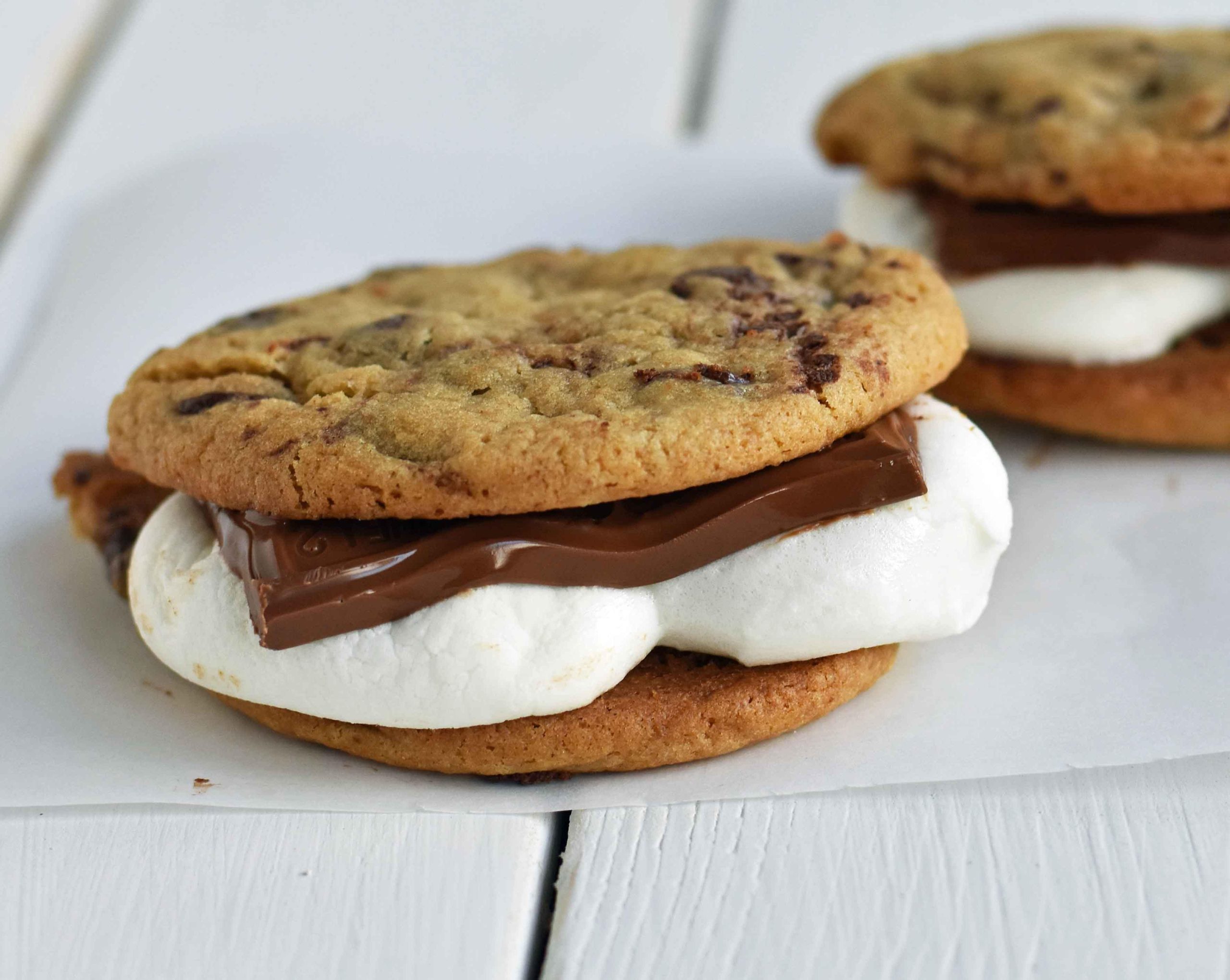Chocolate Chip Cookie S'mores. Warm, homemade chocolate chip cookies sandwiched with melted toasted marshmallow and rich milk chocolate. The ultimate s'mores. www.yamne.com