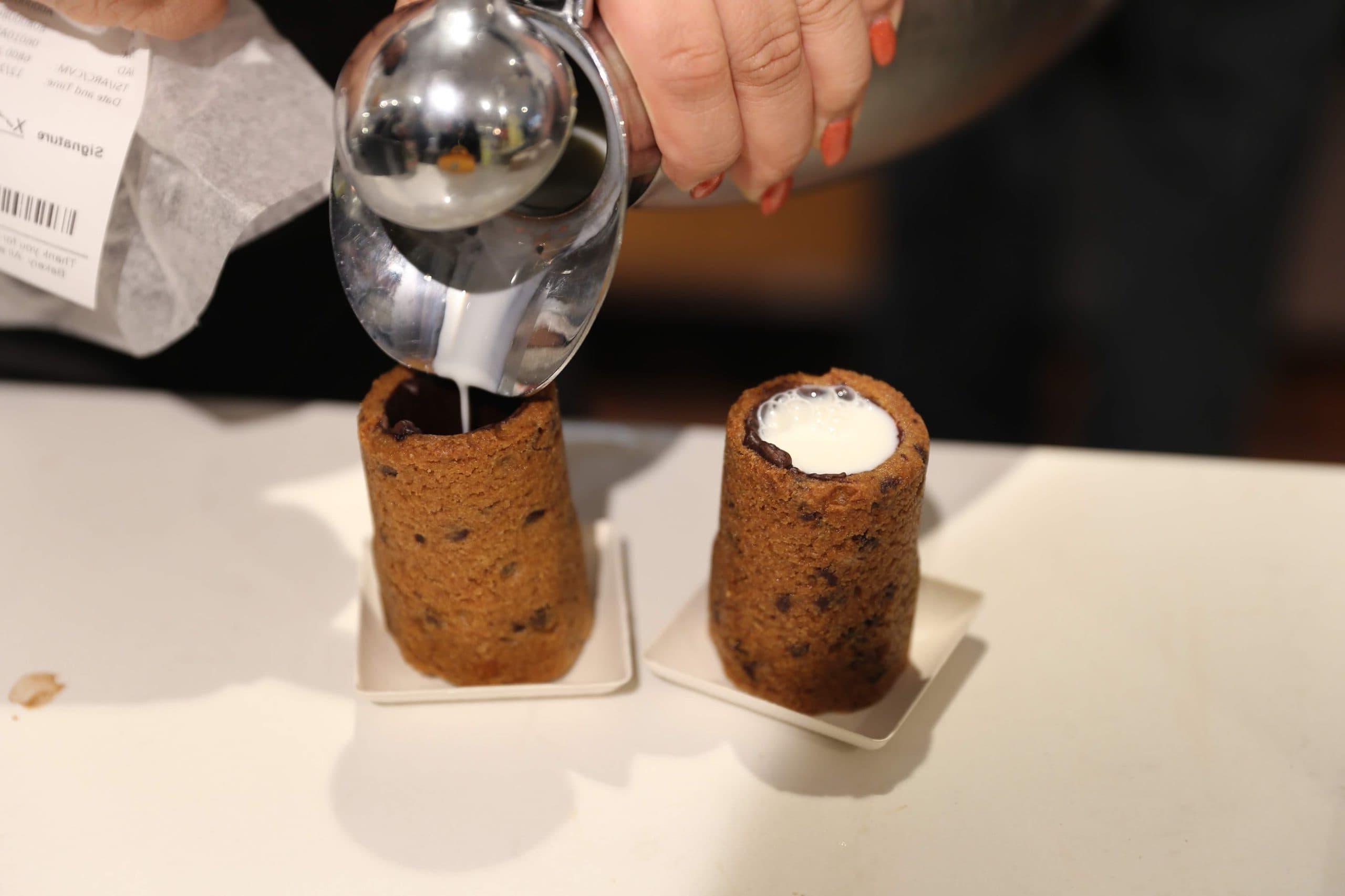 Milk and Cookie Shots The famous Milk and Cookie Shots were made famous at New York City Dominique Ansel Bakery. This soft chocolate chip cookie is shaped into a shot, baked until warm and gooey, lined with chocolate, and served with milk inside. If you love cookies and milk, this is the dessert for you!