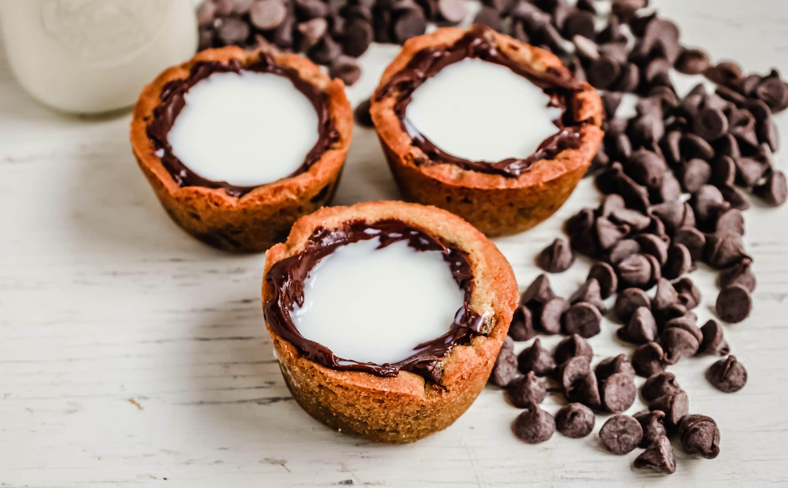 Milk and Cookie Shots The famous Milk and Cookie Shots were made famous at New York City Dominique Ansel Bakery. This soft chocolate chip cookie is shaped into a shot, baked until warm and gooey, lined with chocolate, and served with milk inside. If you love cookies and milk, this is the dessert for you!