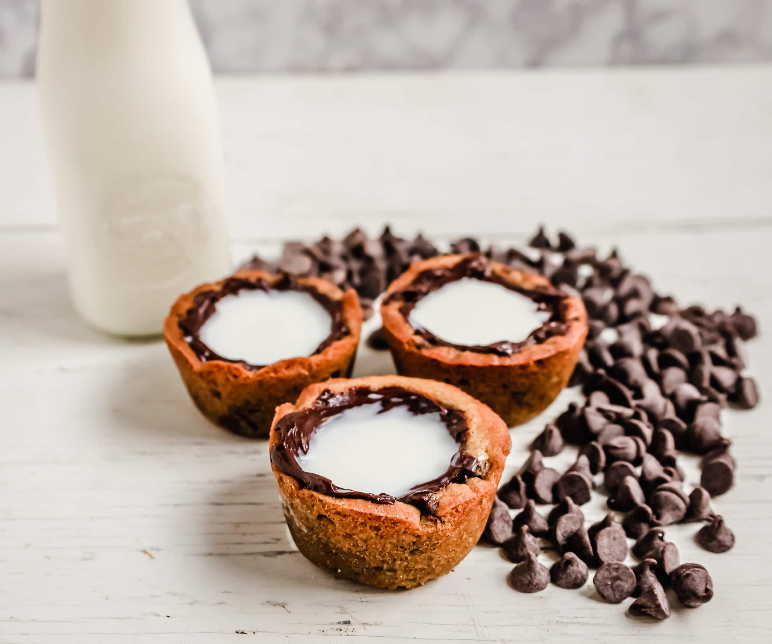 Milk and Cookie Shots The famous Milk and Cookie Shots were made famous at New York City Dominique Ansel Bakery. This soft chocolate chip cookie is shaped into a shot, baked until warm and gooey, lined with chocolate, and served with milk inside. If you love cookies and milk, this is the dessert for you!