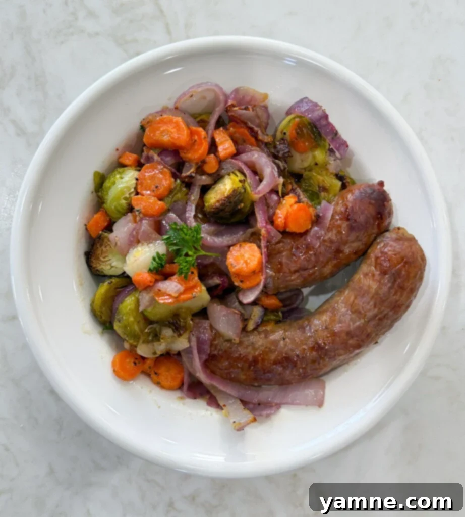 One-Pan Sweet Italian Sausage and Veggies 5 Plated sheet pan Italian sausages and vegetables, ready to eat