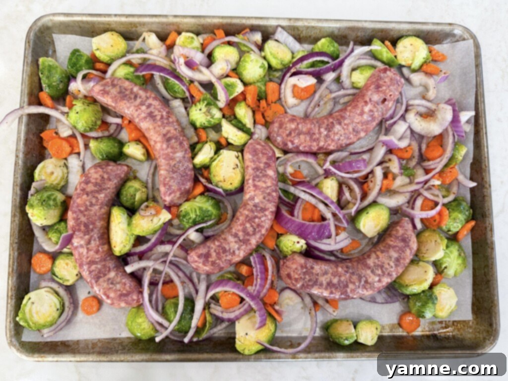 One-Pan Sweet Italian Sausage and Veggies 7 Baked sheet pan Italian sausages and veggies, golden brown