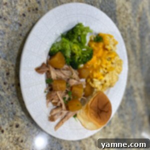 Delicious Slow Cooker Pineapple Shredded Pork served over rice