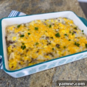 Delicious Grits Breakfast Sausage Casserole with melted cheese and savory sausage