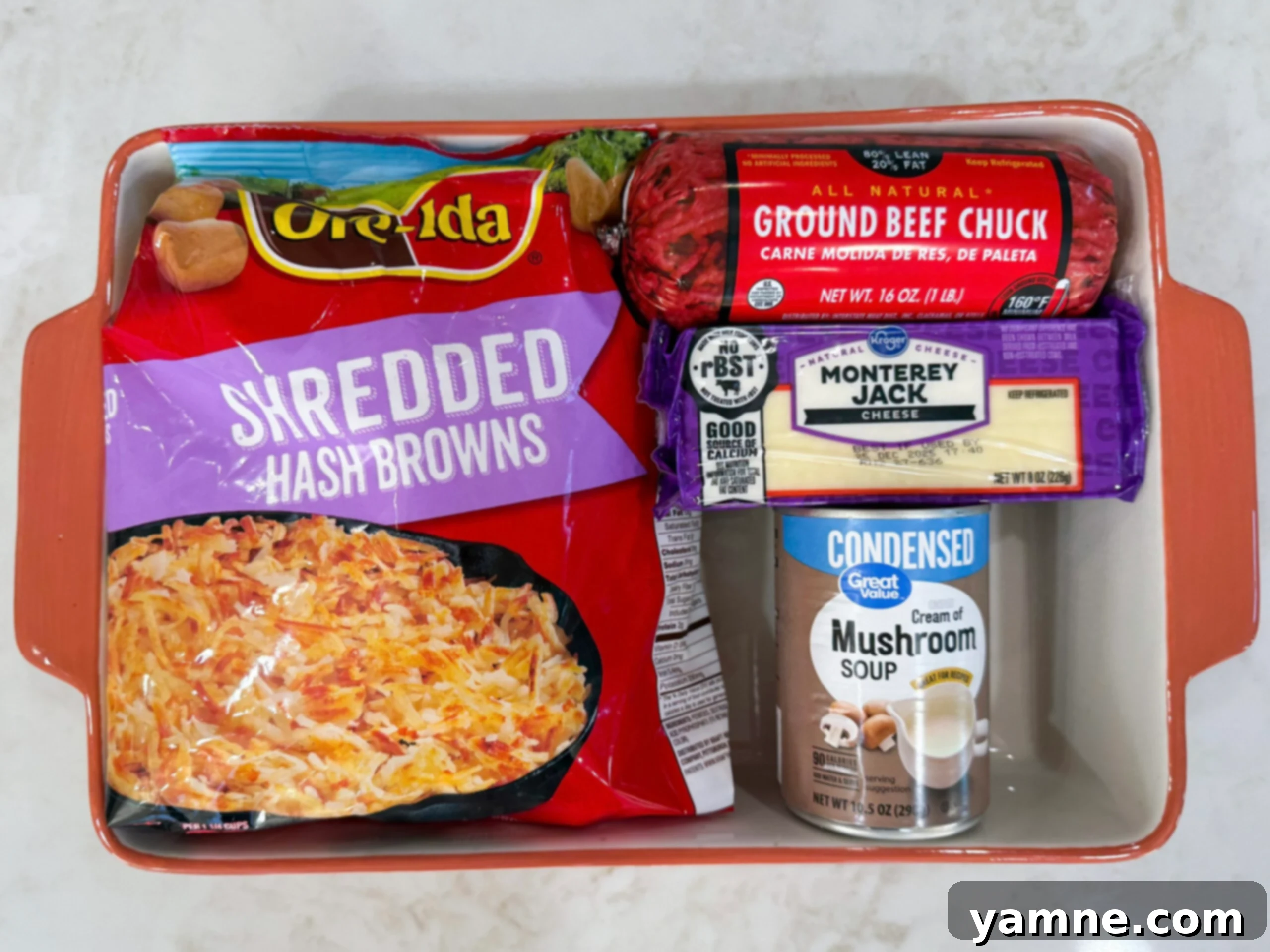 Ingredients for hashbrown hamburger casserole on counter