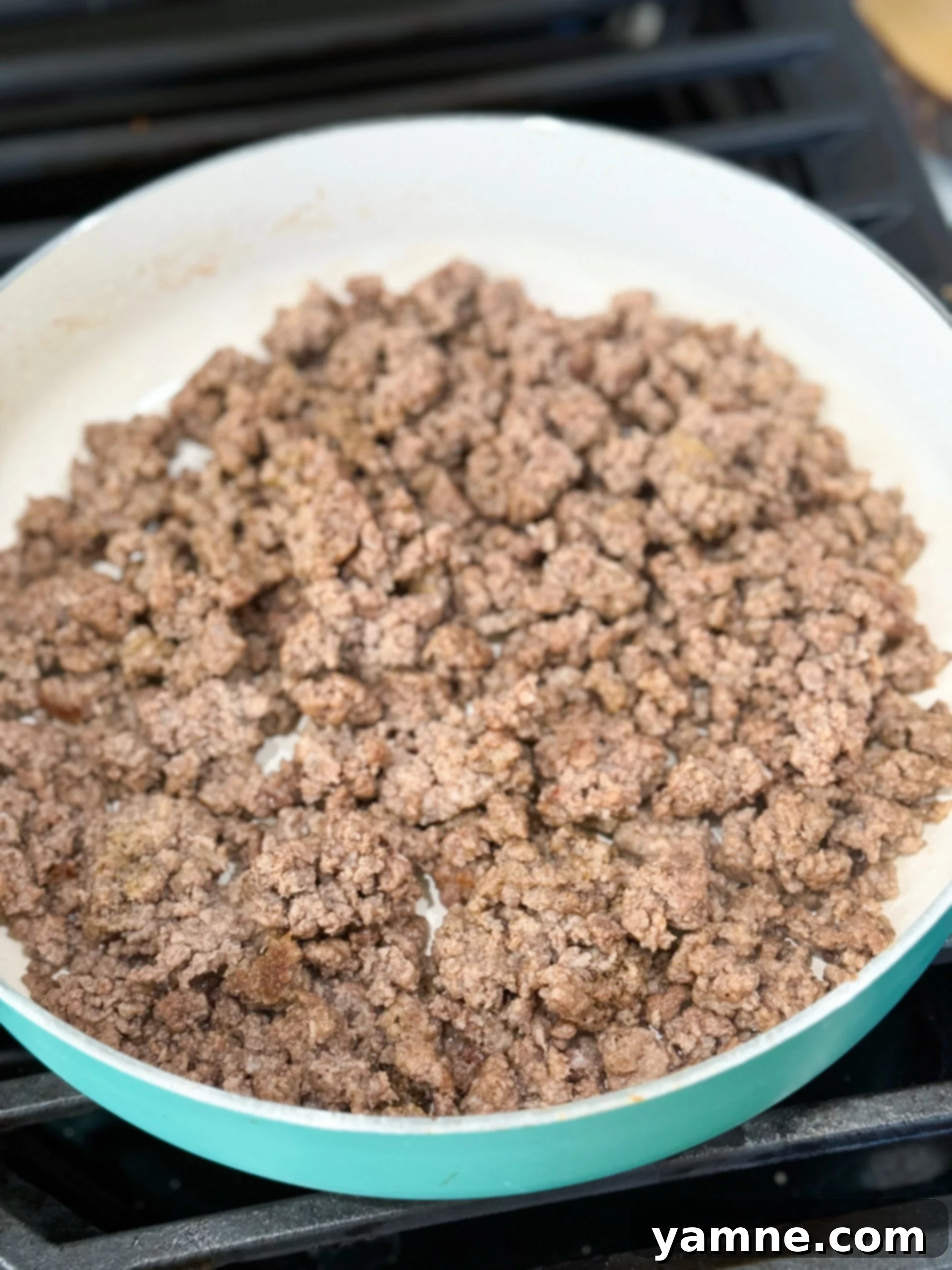 Ground beef cooking in skillet