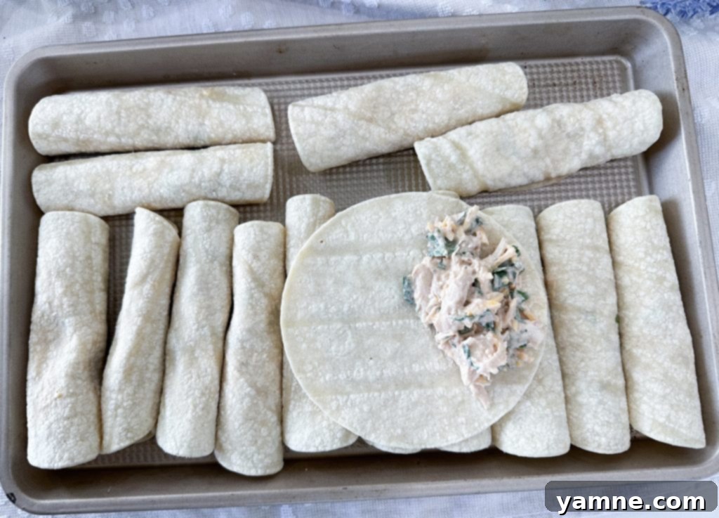 Crispy Cheesy Chicken Taquitos 5 rolling cheesy chicken taquitos with filling