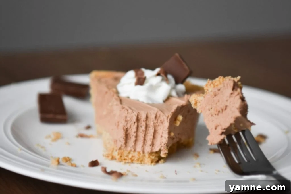 A freshly sliced piece of No-Bake Hershey’s Chocolate Pie on a plate