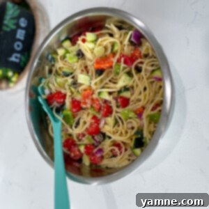 Vibrant California Spaghetti Salad with fresh vegetables in a large bowl