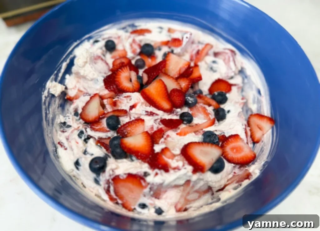 The best Red, White, and Blue Cheesecake Fruit Salad for 4th of July gatherings