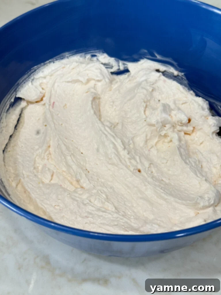 Mixing ingredients for the creamy cheesecake base