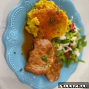 Delicious Slow Cooker Coca-Cola Pork Chops with a rich, dark sauce