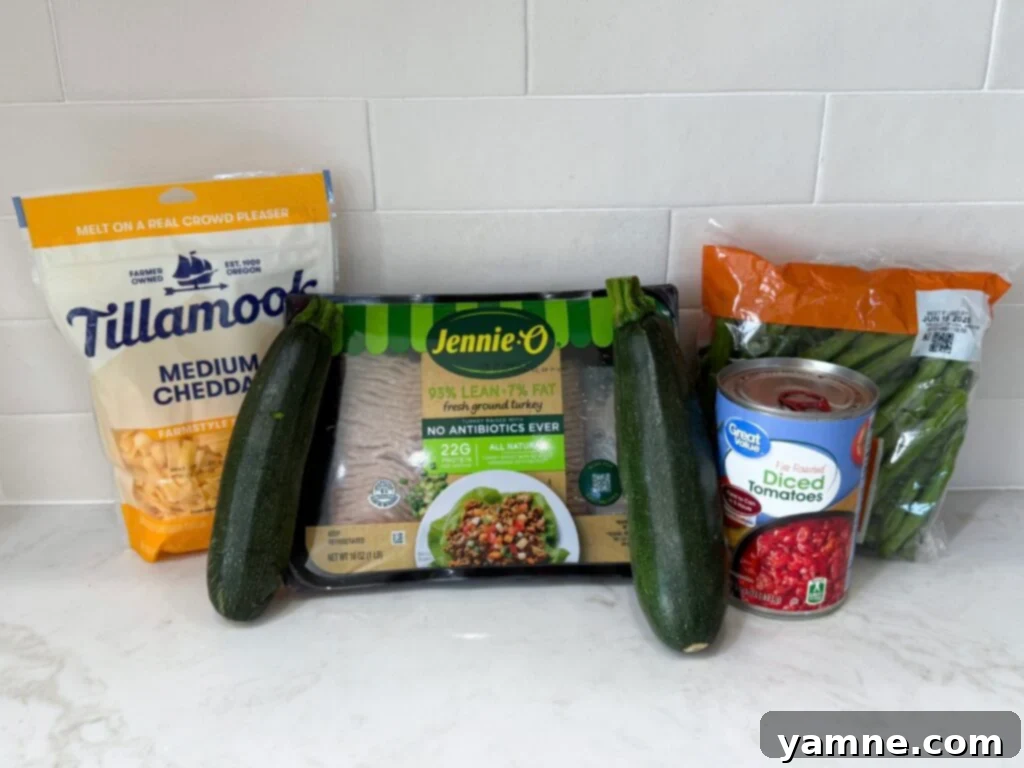 Healthy Turkey and Veggie Skillet 3 Fresh ingredients laid out including zucchini, onion, green beans, and ground turkey