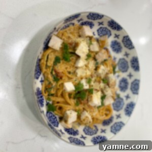 Tuscan Chicken and Pasta with creamy sauce, sun-dried tomatoes, and spinach