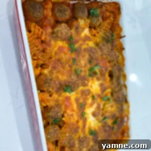 Hearty Meatball and Pasta Bake 2 Delicious Meatball Pasta Casserole with melted cheese and fresh herbs