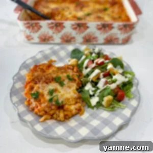 Close-up of a delicious pepperoni pasta bake, golden brown and bubbly with melted cheese and crispy pepperoni slices.