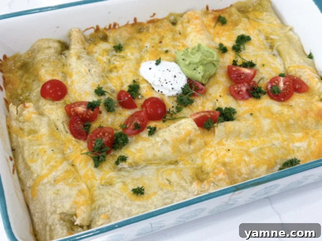 Ultimate Green Chile Chicken Enchiladas 8 Close-up of a perfectly rolled green chili chicken enchilada.