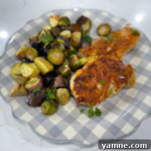 Cheddar Crusted Sheet Pan Pork Chops with Roasted Brussels Sprouts and Potatoes