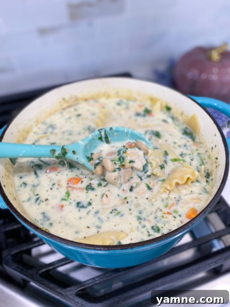 One-Pot White Chicken Lasagna Soup, a creamy, cheesy, and hearty soup with chicken, cannellini beans, and broken lasagna noodles.