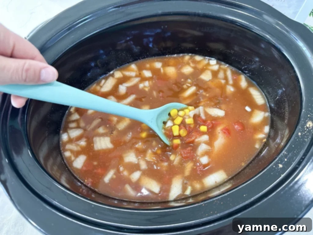 Effortless Chicken Tortilla Soup: A Slow Cooker Delight 3 Adding ingredients to slow cooker