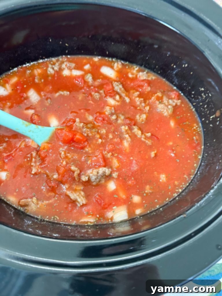 adding ingredients to the slow cooker