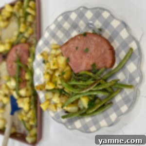 One-Pan Honey Mustard Ham, Green Beans, and Potatoes 4 Sheet Pan Honey Mustard Ham, Green Beans, and Potatoes on a serving plate.