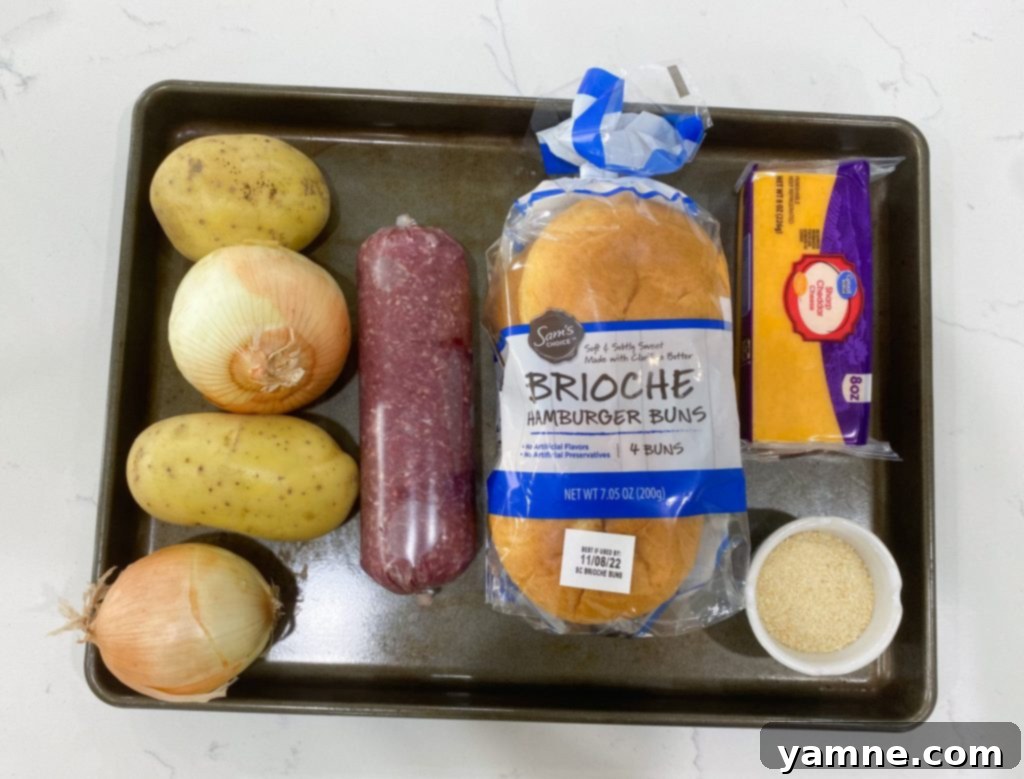 Sheet Pan Burgers with Onions and Potatoes ready to serve