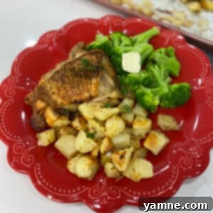 Golden-brown Sheet Pan Greek Chicken Thighs and Potatoes, ready to serve.