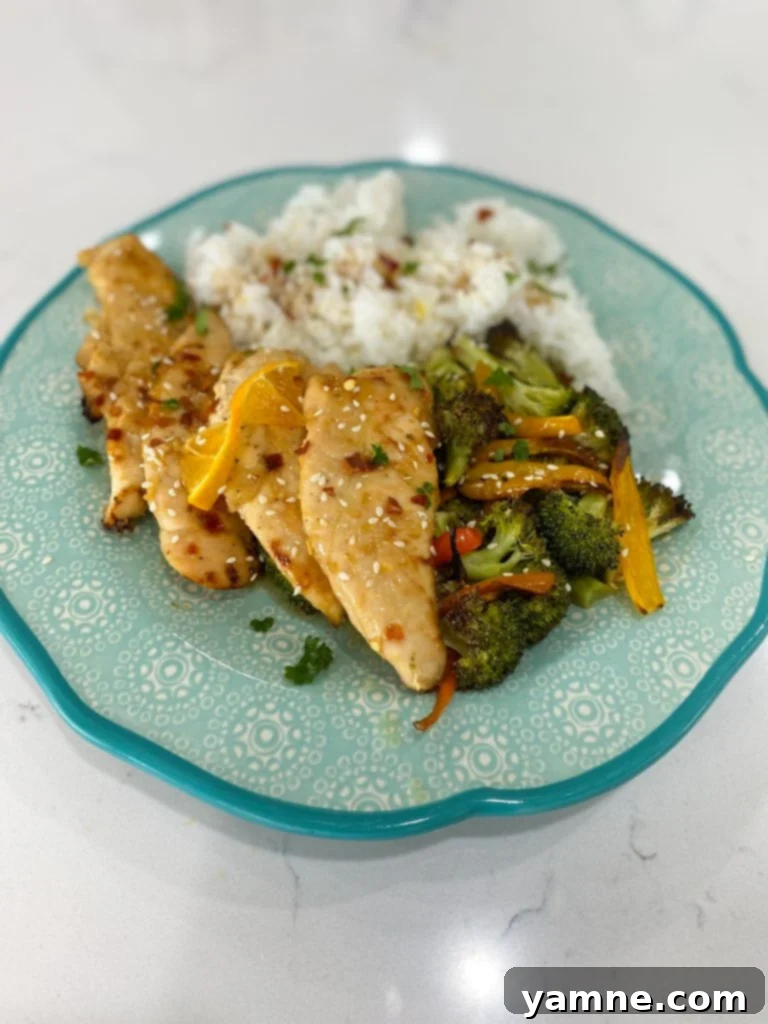 Light and Zesty Orange Chicken 4 Finished healthy orange chicken dish on a sheet pan