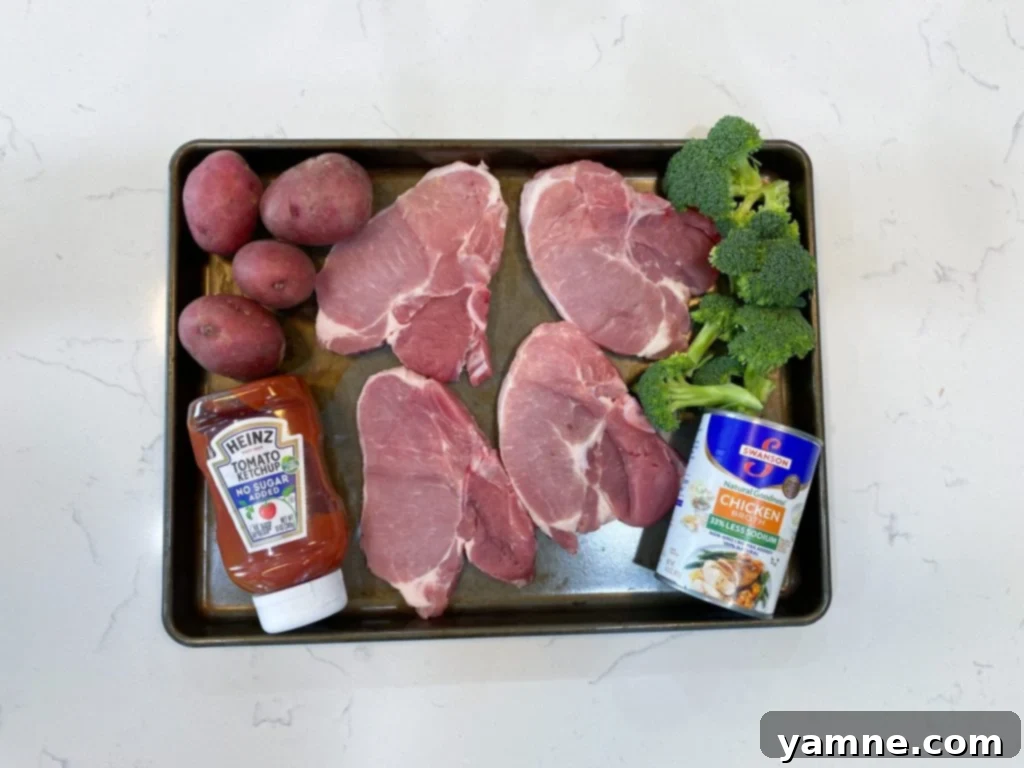 Pork Chop Sheet Pan Dinner with broccoli and red potatoes