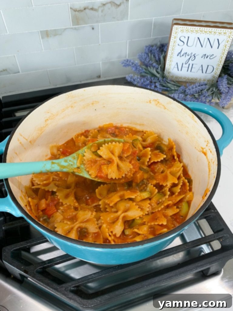 One-Pan Tuscan Vegetable Pasta 3 Various diced and sliced fresh vegetables including bell peppers, zucchini, onions, and mushrooms, ready for a one-pot pasta dish.