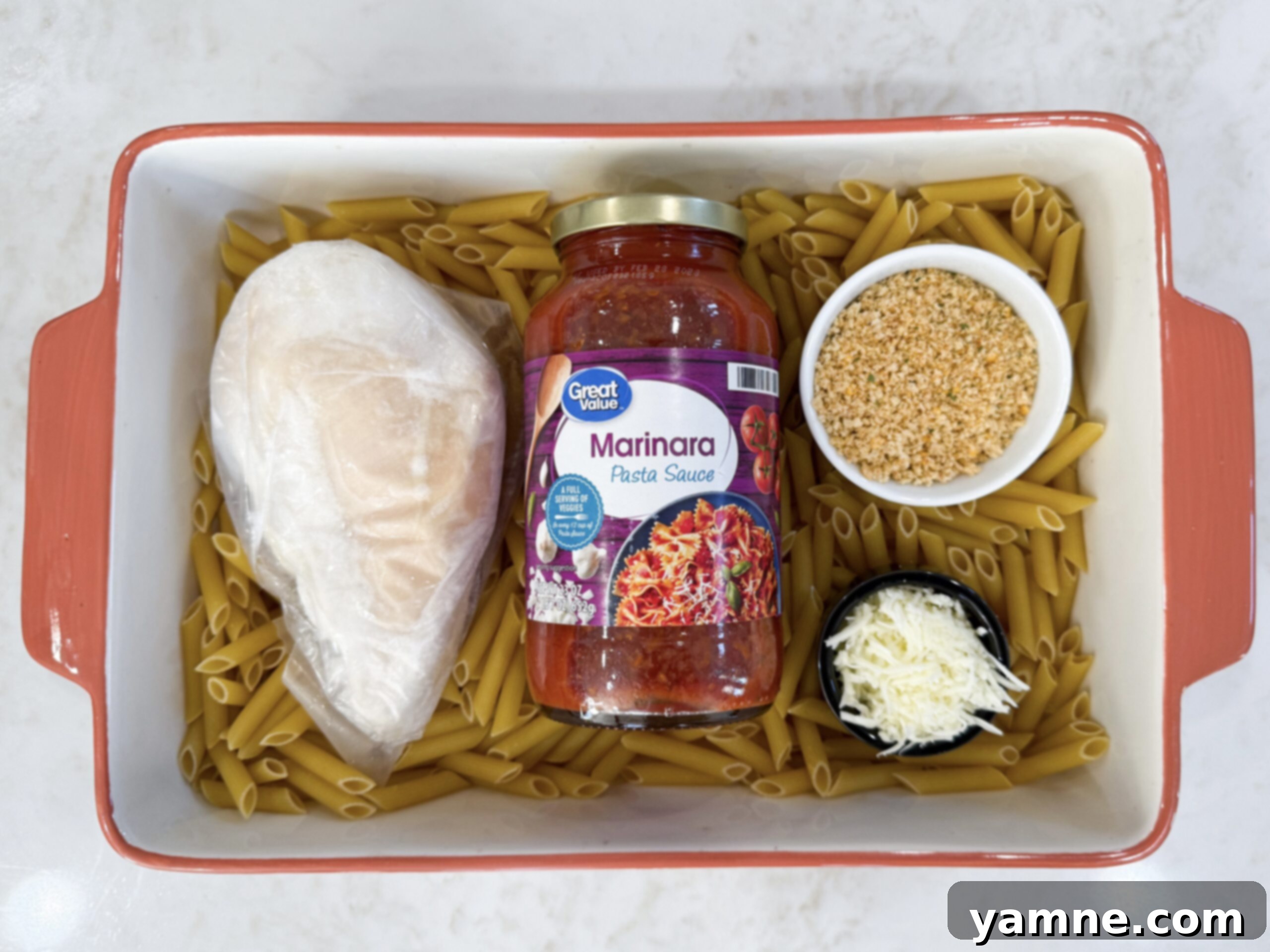 Cheesy Chicken Parm Bake 5 Ingredients for chicken parmesan casserole in casserole dish