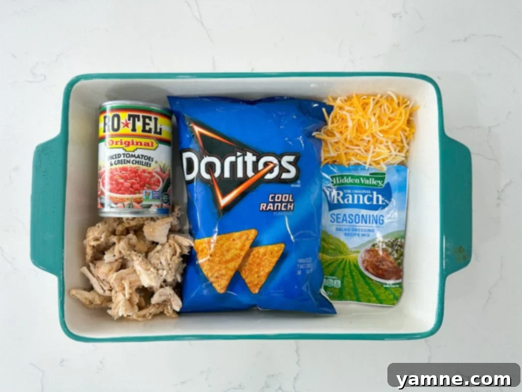 Close-up of a serving of Dorito Chicken Casserole with melted cheese and crushed Doritos on top