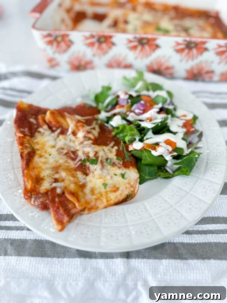 Close-up of fresh ricotta cheese and seasonings mixed in a bowl, ready for manicotti filling.