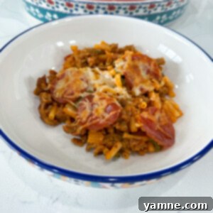 Macaroni and Cheese Pizza Casserole ready to bake with cheese and pepperoni on top