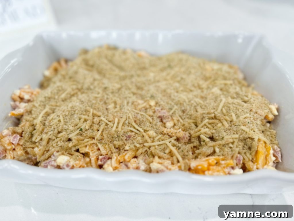 Cheesy Ham Macaroni Bake 3 Scoops of creamy Cheesy Ham Macaroni and Cheese Casserole on plates