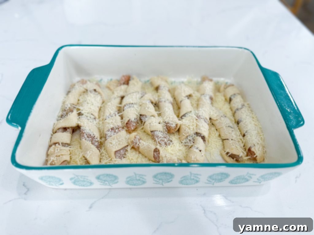 Wrapped chicken placed in baking dish.