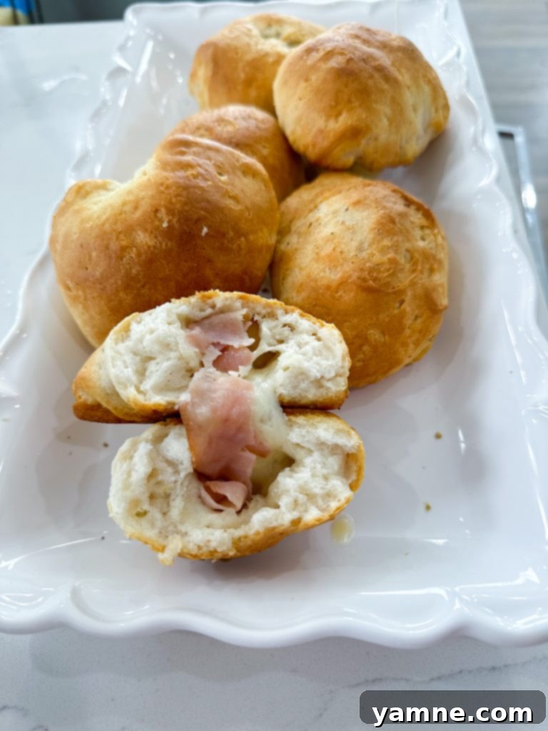 Stuffed Ham and Cheese Biscuits on a plate, ready to be enjoyed as a quick meal.