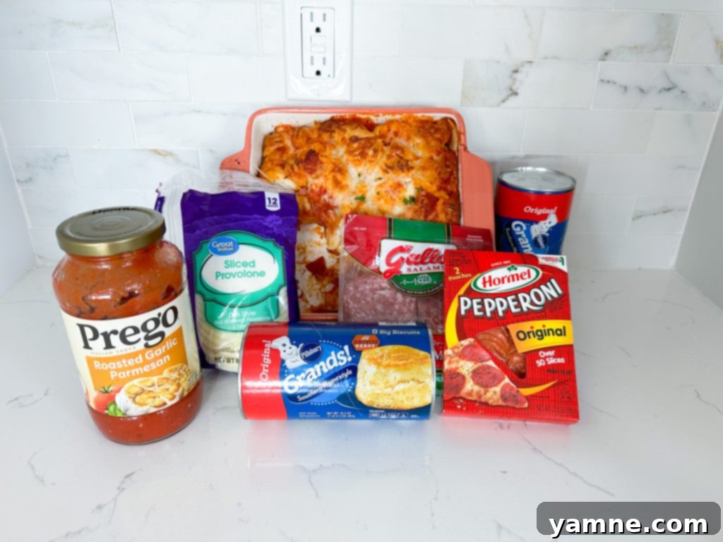 Close-up of baked Italian Sub Casserole, showcasing golden-brown biscuits, melted cheese, and visible deli meats.