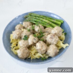 Delicious Creamy Swedish Meatballs served over egg noodles