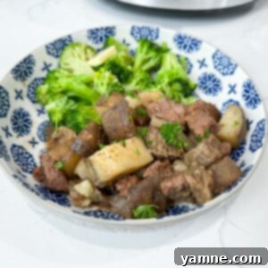 Garlic Steak Bites in a slow cooker, ready to serve.