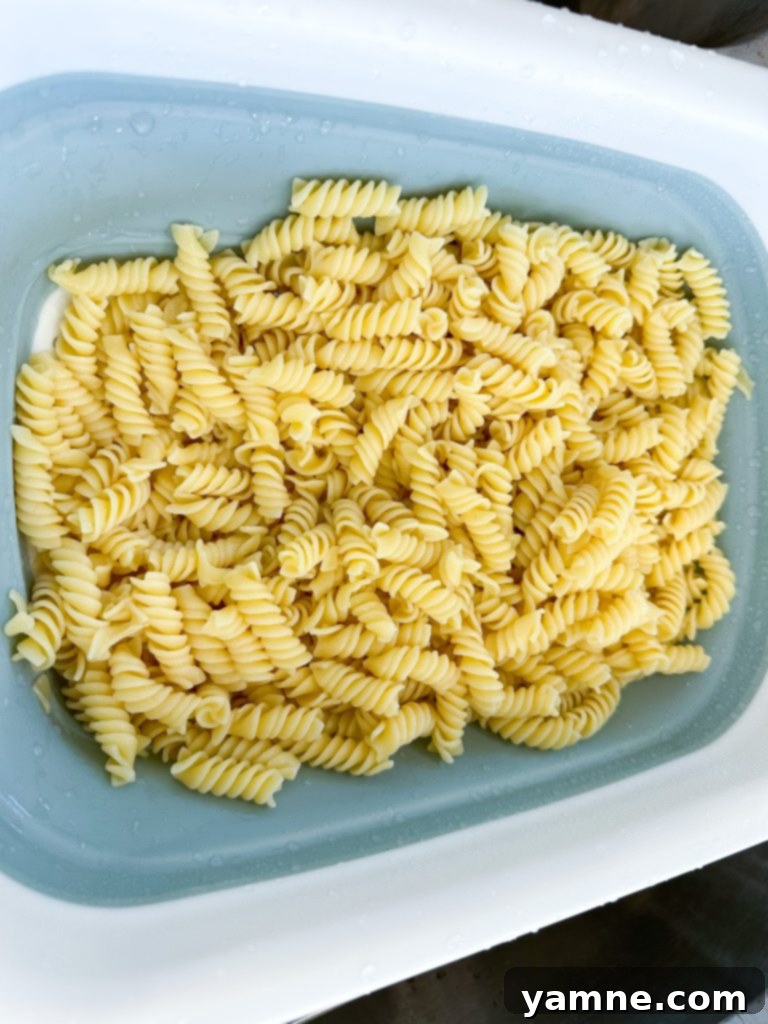 Mixing the Doritos Taco Pasta Salad in a large bowl.