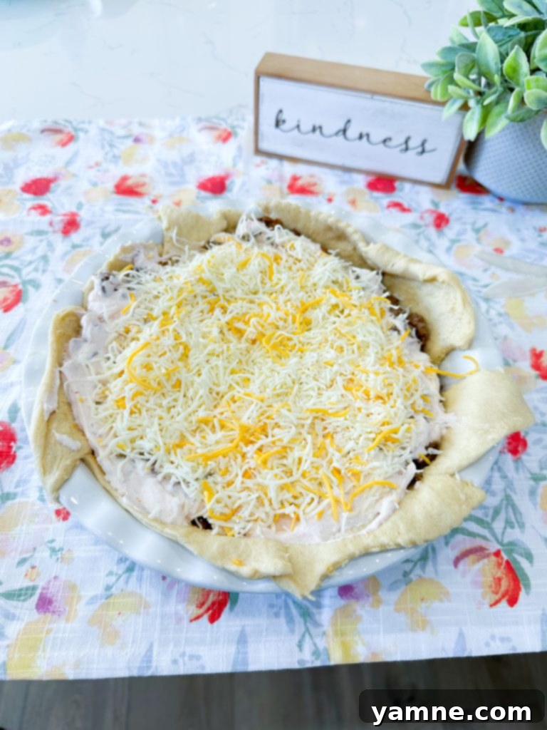 Doritos Taco Bake 7 Seasoned ground beef layered over Dorito crust in taco pie