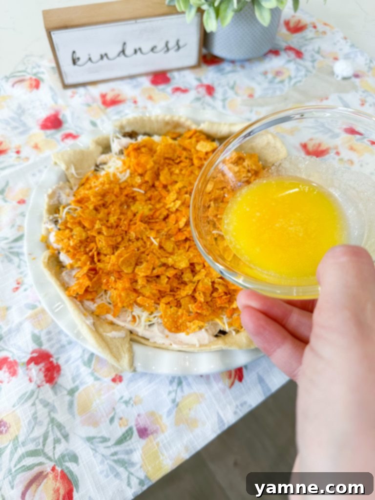 Doritos Taco Bake 9 Shredded cheese and remaining Doritos added to the taco pie