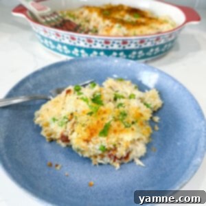 A fully baked Chicken Alfredo Rice Casserole, golden and bubbly.