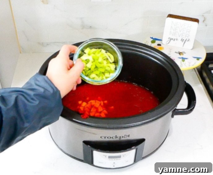 Fall-Apart Slow Cooker Beef Ragu 7 Mixing all ragu ingredients in slow cooker