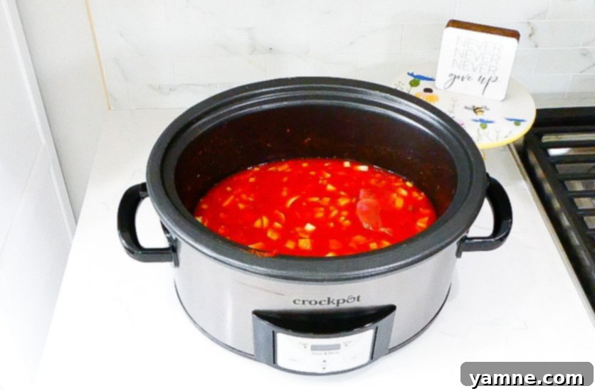 Fall-Apart Slow Cooker Beef Ragu 9 Slow cooker beef ragu simmering