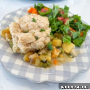 Delicious Slow Cooker Vegetable Pot Pie with a golden biscuit topping