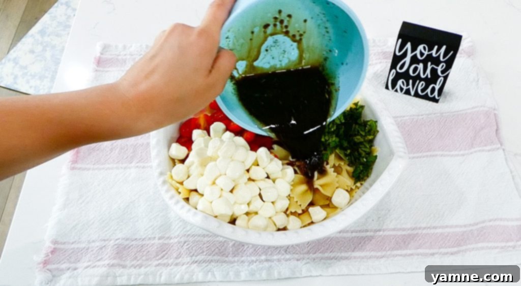 The fully dressed Caprese Pasta Salad, ready to be served.