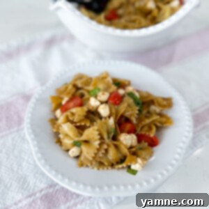 A bowl of Caprese Pasta Salad ready to be served.